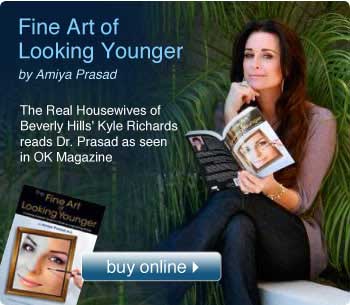 Kyle Richards reading The Fine Art of Looking Younger book written by Dr. Amiya Prasad